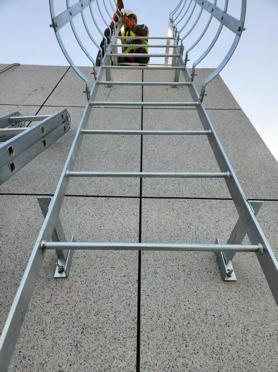 Pre-assembled caged fixed ladders on the factory floor